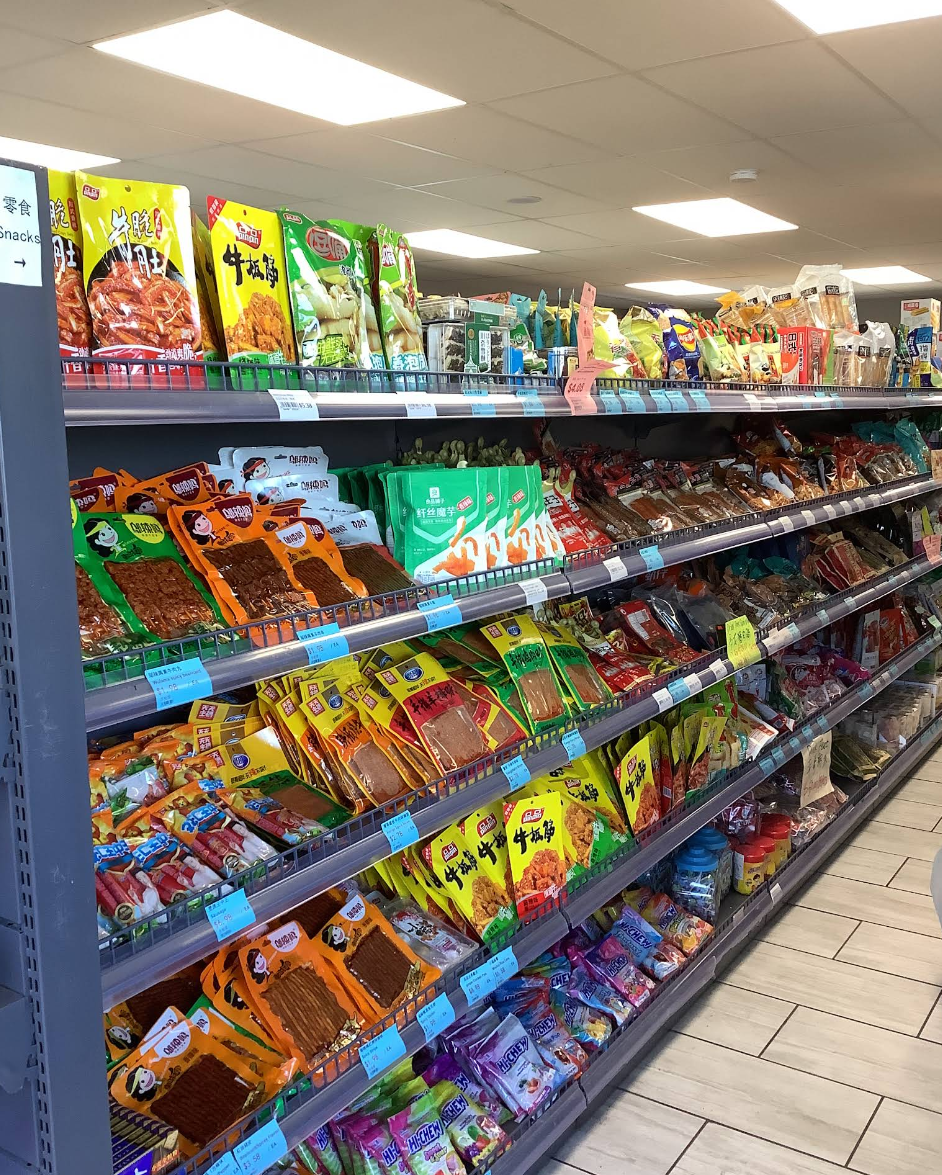 Shelves stocked with Asian snacks and pantry foods